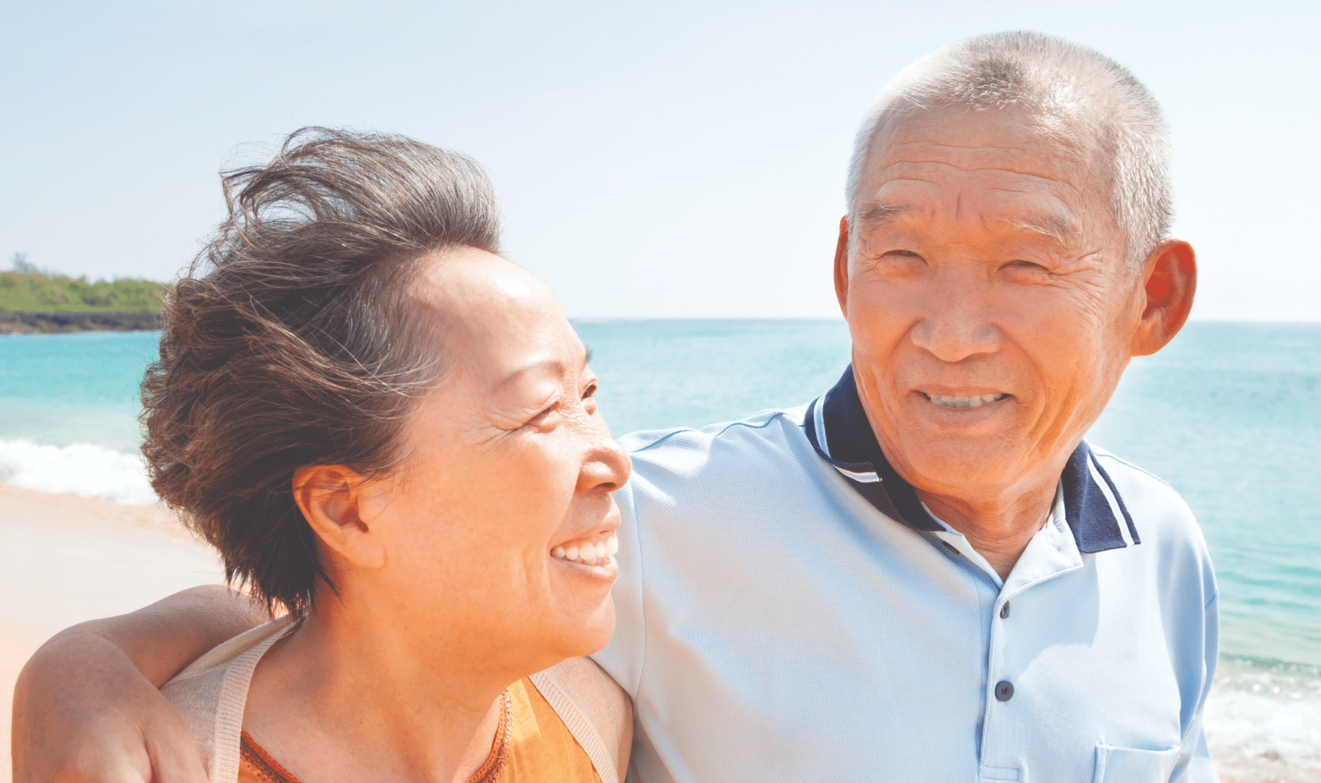 Elderly man smiling with wife, representing quality of life despite BPH symptoms and prostate swelling